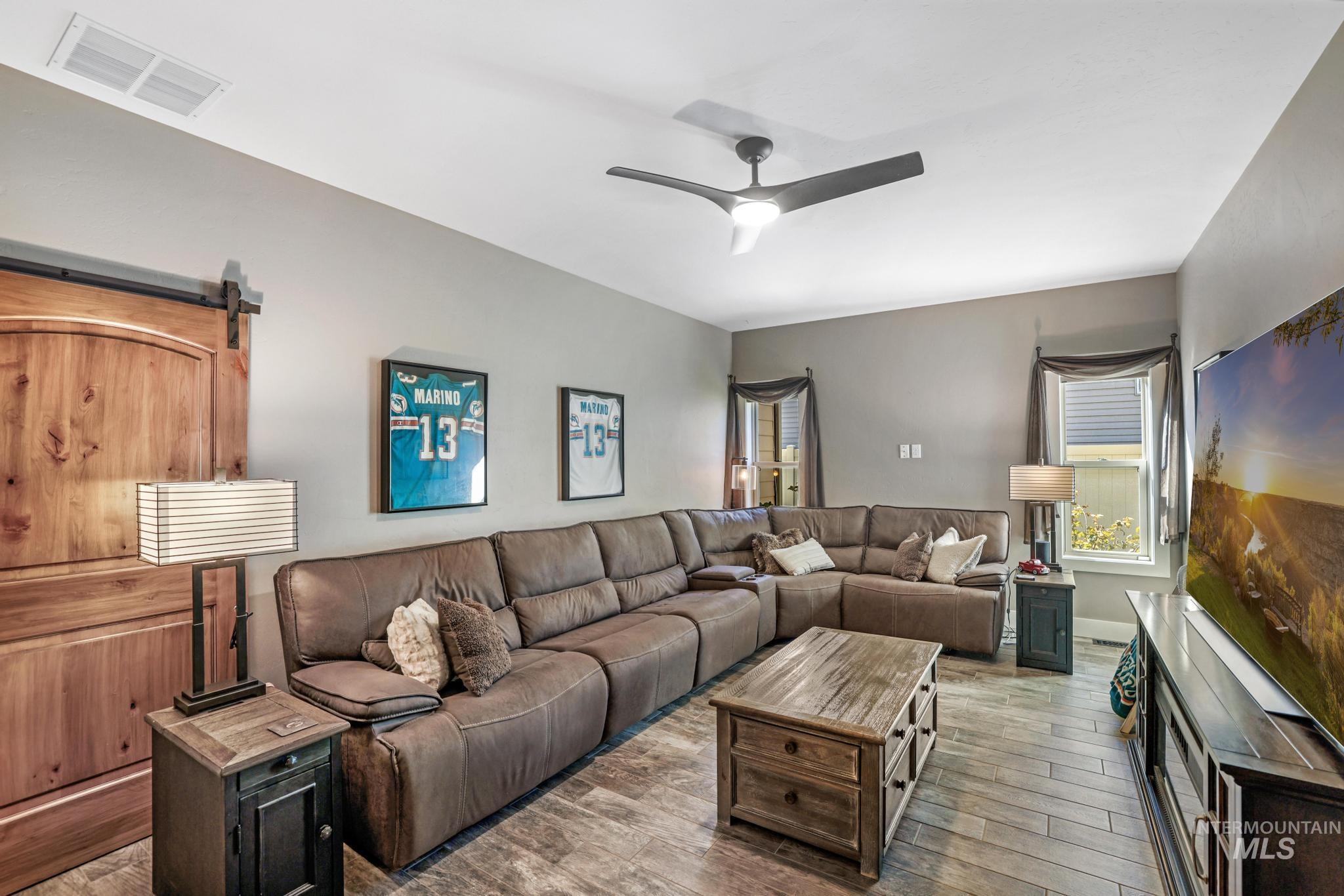 2043 Prospector Way Twin Falls, ID 83301 - Photo 11 of 29 Living room with wood finished floors and a ceiling fan