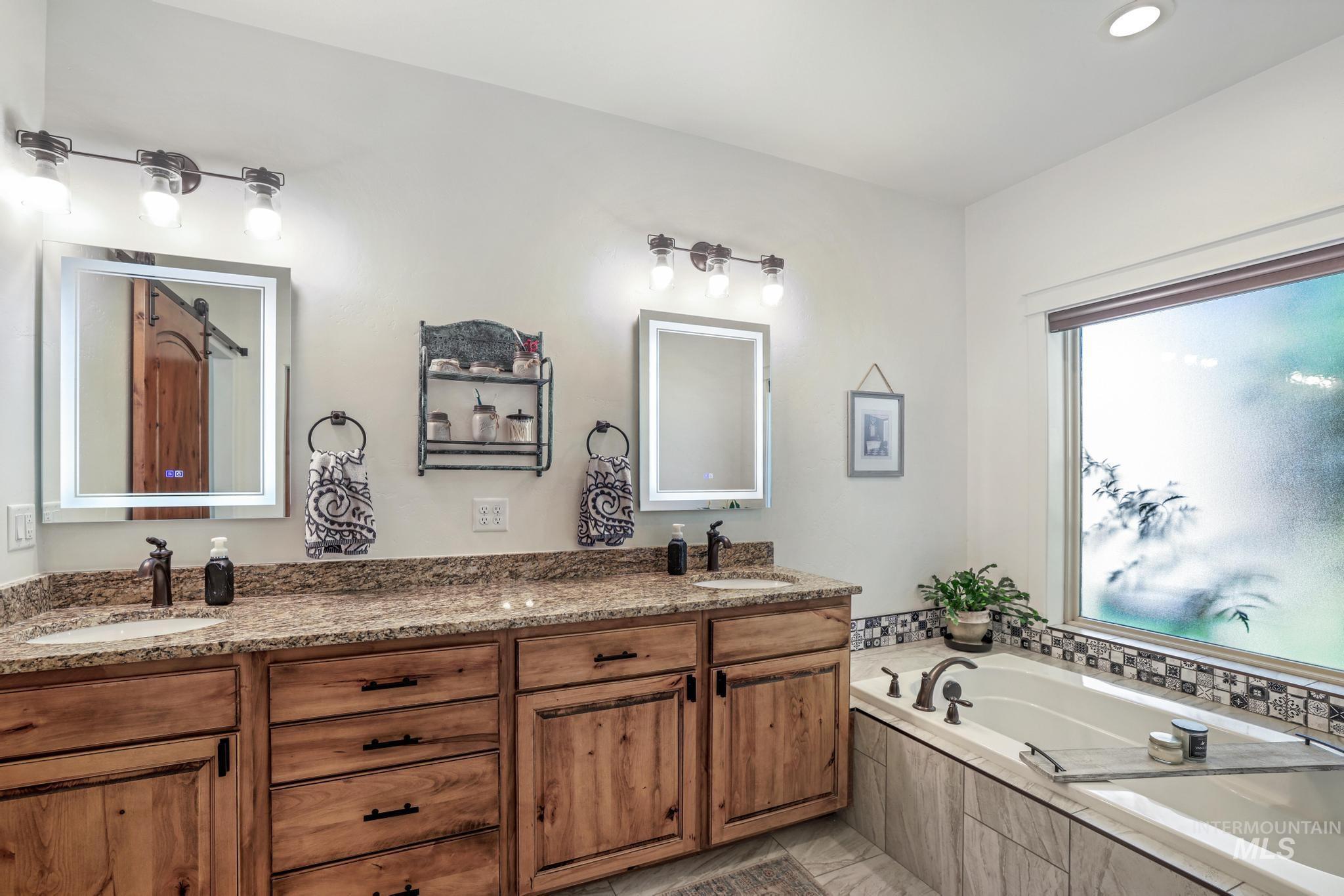 2043 Prospector Way Twin Falls, ID 83301 - Photo 18 of 29 Full bath with double vanity, a bath, and recessed lighting