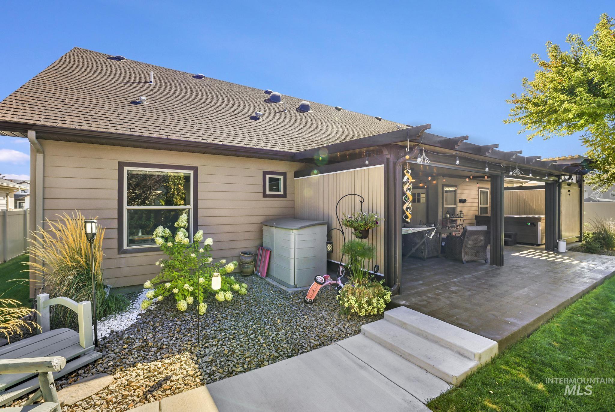 2043 Prospector Way Twin Falls, ID 83301 - Photo 20 of 29 Back of property featuring a pergola, roof with shingles, and a patio area