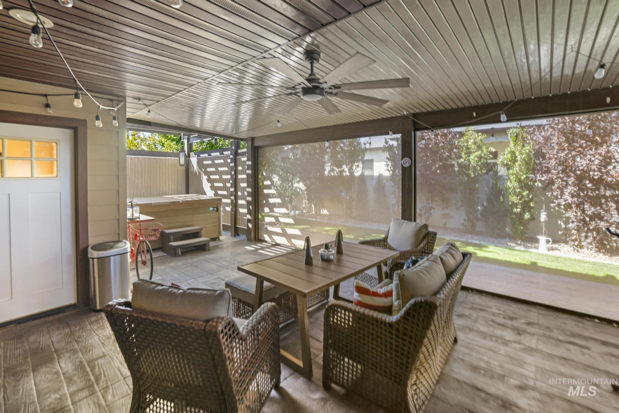 2043 Prospector Way Twin Falls, ID 83301 - Photo 25 of 29 Sunroom with a ceiling fan and outdoor dining space