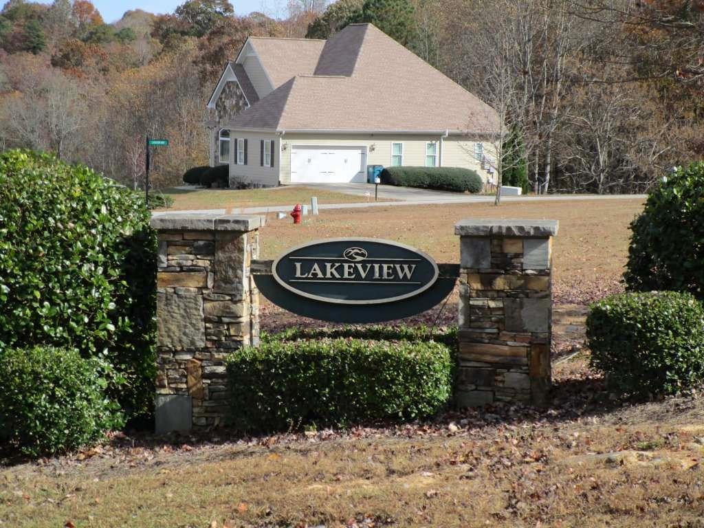 136 Lakeview Way Baldwin, GA 30511 - Photo 6 of 13 a front view of a house with garden