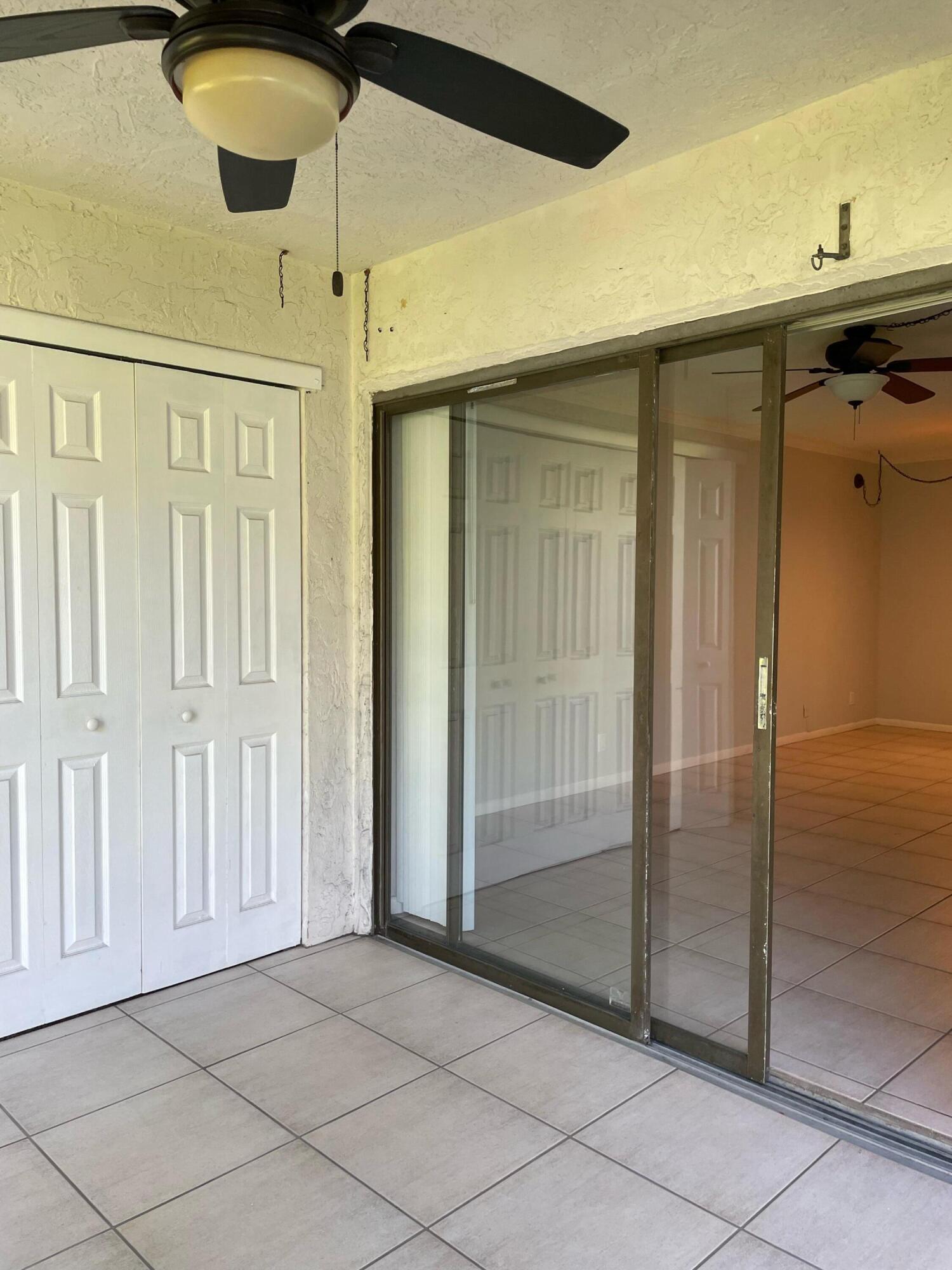 9440 Southwest 8th Street, Unit 217 Boca Raton, FL 33428 - Photo 17 of 28 an empty room with fan