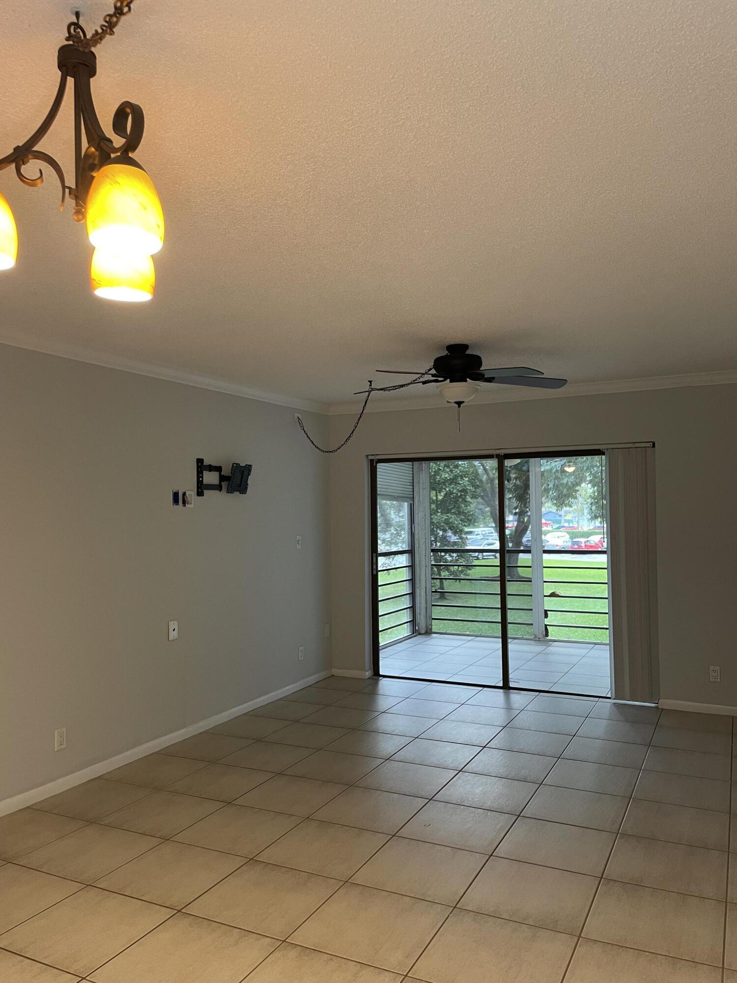 9440 Southwest 8th Street, Unit 217 Boca Raton, FL 33428 - Photo 2 of 28 an empty room with window