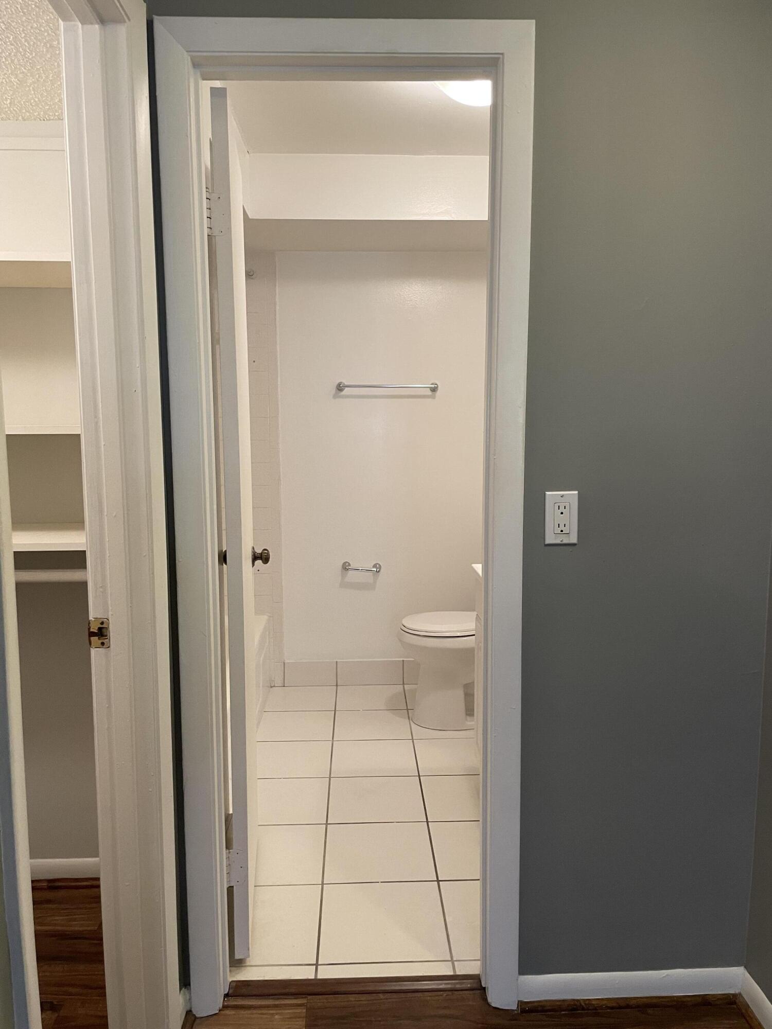 9440 Southwest 8th Street, Unit 217 Boca Raton, FL 33428 - Photo 24 of 28 a bathroom with a toilet