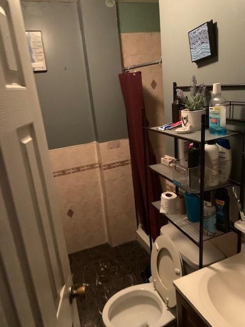 1129 Broadway Brooklyn, NY 11221 - Photo 14 of 15 a bathroom with a sink toilet and shower