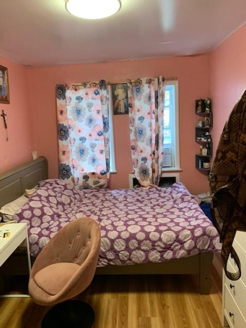 1129 Broadway Brooklyn, NY 11221 - Photo 10 of 15 a bedroom with a bed and a dresser