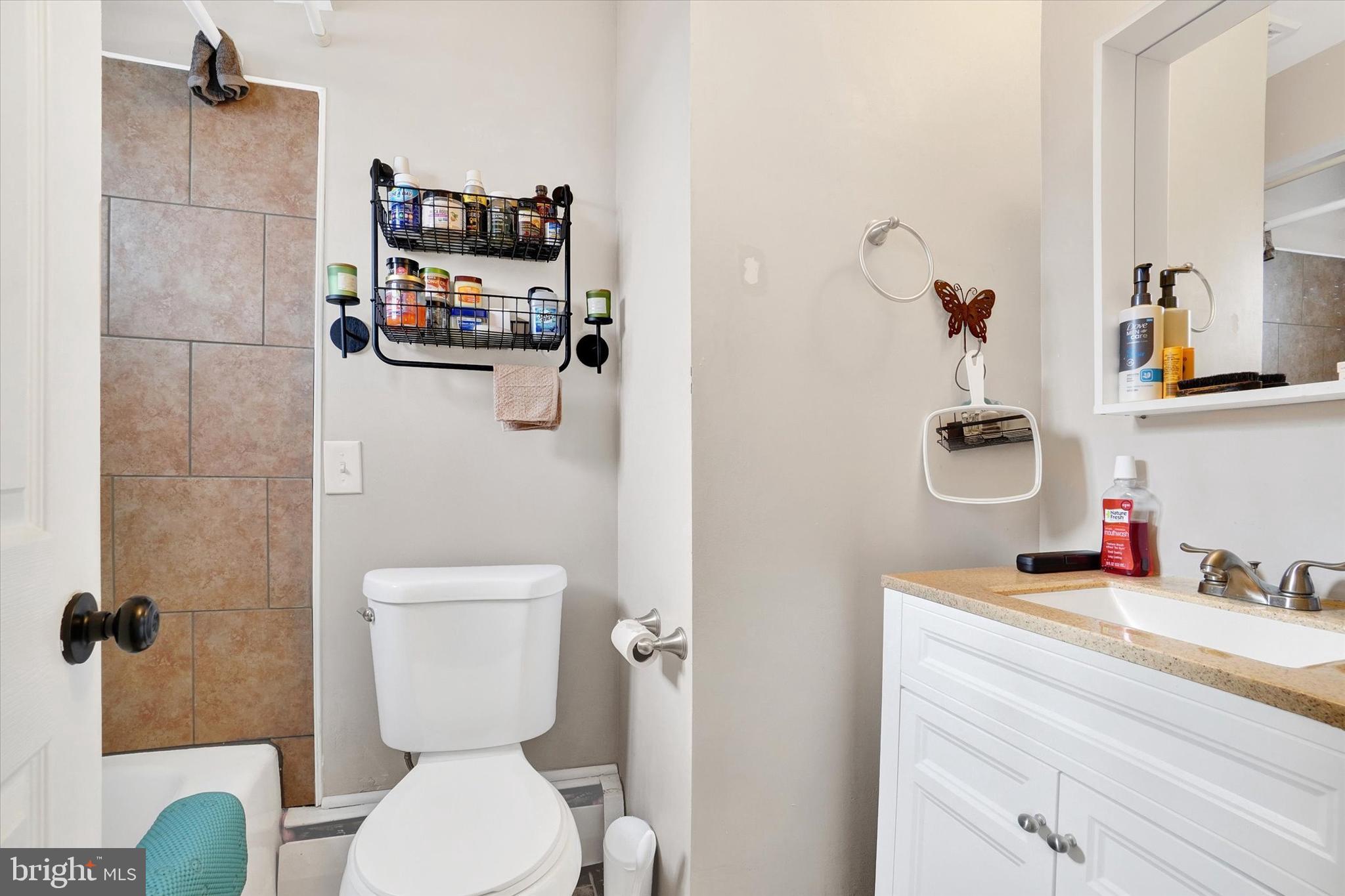 1270 Glendale Road York, PA 17403 - Photo 12 of 31 a bathroom with a toilet sink and mirror