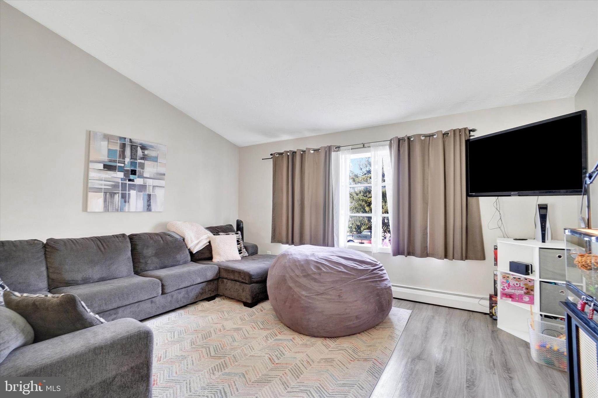 1270 Glendale Road York, PA 17403 - Photo 3 of 31 a living room with furniture and a flat screen tv