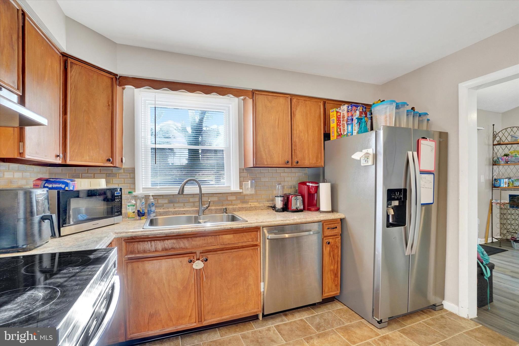 1270 Glendale Road York, PA 17403 - Photo 8 of 31 a kitchen with stainless steel appliances granite countertop a refrigerator sink and cabinets