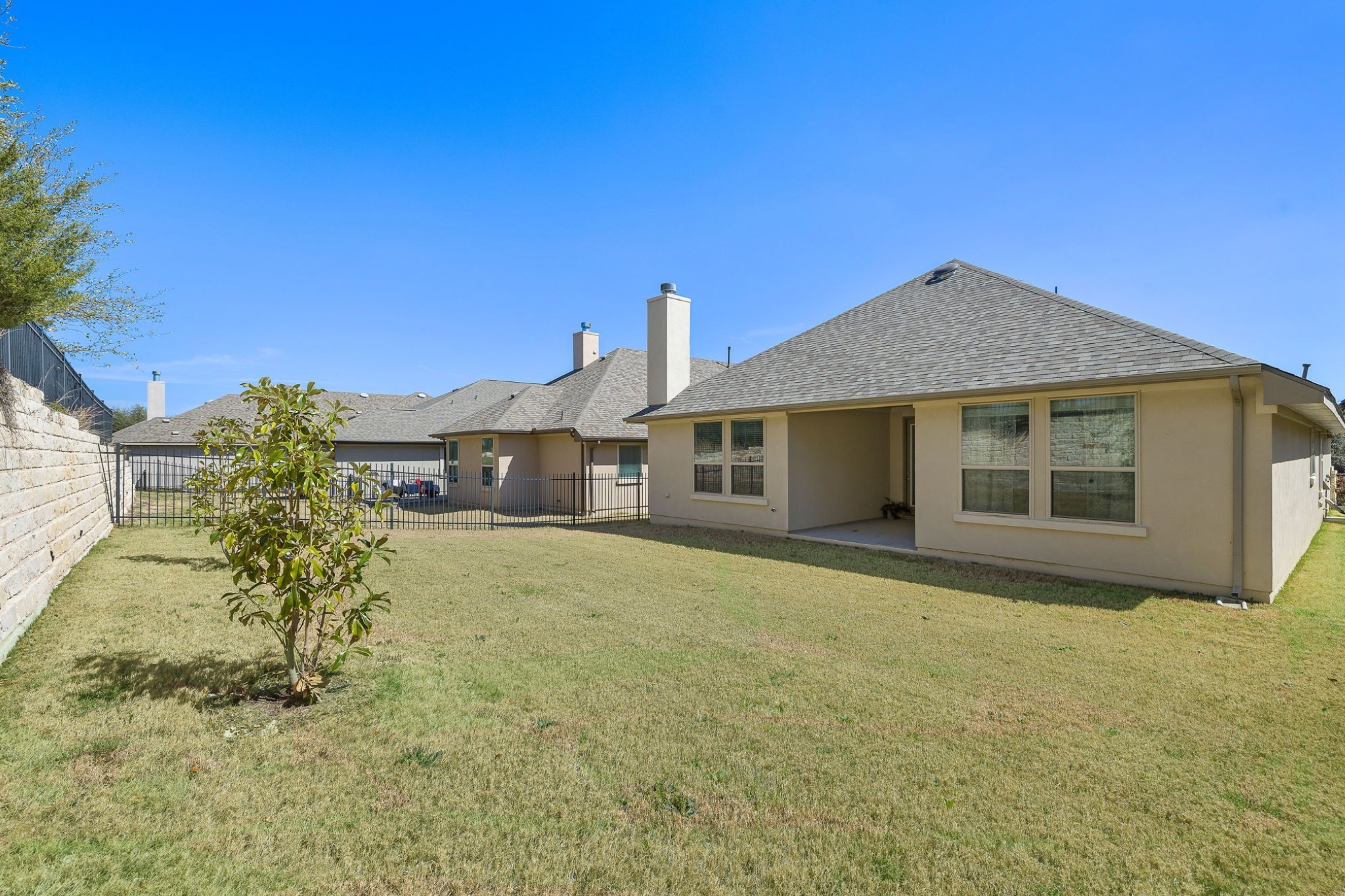 4201 Vespa Cove Leander, TX 78641 - Photo 19 of 29 a front view of a house with a garden