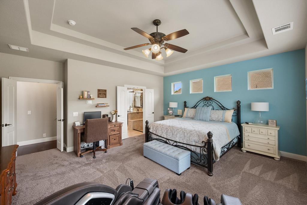 445 Rusty Run Drive Midlothian, TX 76065 - Photo 23 of 40 a bedroom with a bed gym equipment and a chandelier