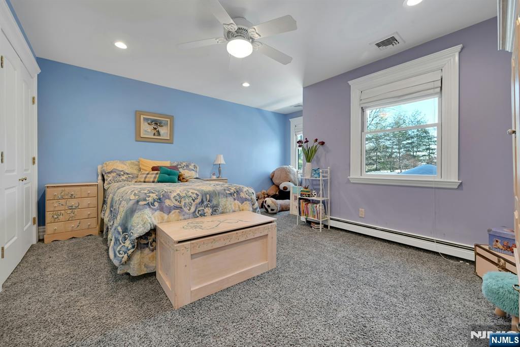 285 Chestnut Ridge Road Woodcliff Lake, NJ 07677 - Photo 30 of 46 a bedroom with a bed and a window