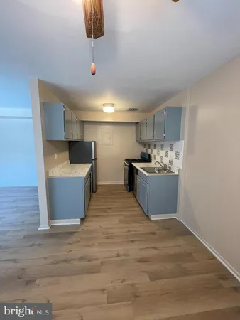 a view of a kitchen with a sink