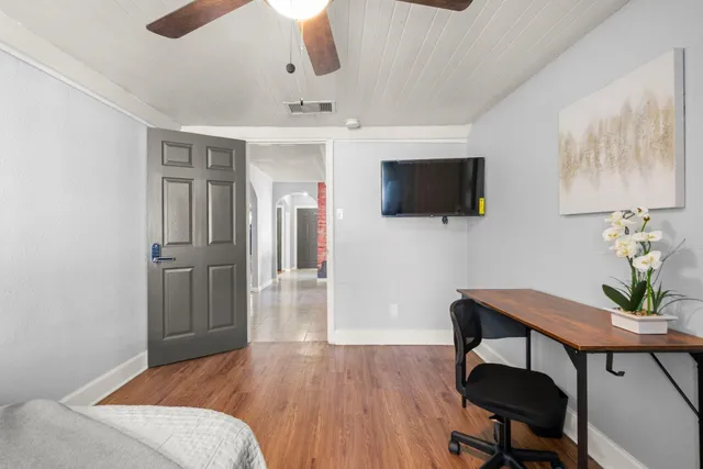 a kitchen that has a lot of cabinets and a sink