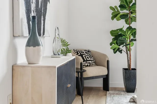 a bedroom with a bed and a chair