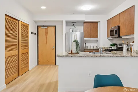 a kitchen with a stove and a refrigerator