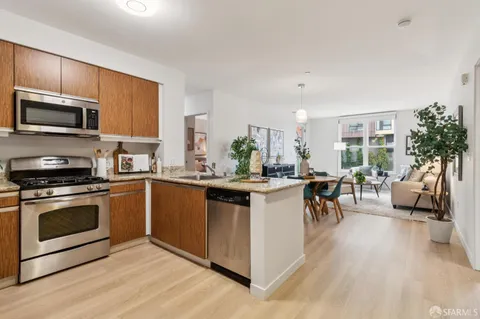 a outdoor living room with furniture and a potted plant