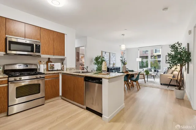 a outdoor living room with furniture and a potted plant