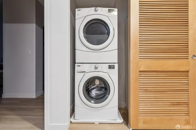 a bathroom with a granite countertop toilet sink and mirror