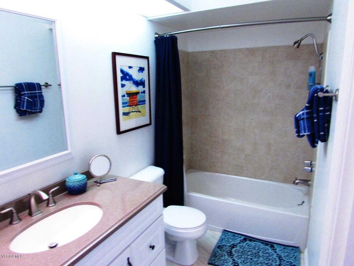 3101 Peninsula Road, Unit 312 Oxnard, CA 93035 - Photo 11 of 14 a bathroom with a sink toilet and shower
