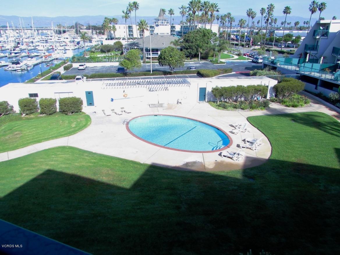 3101 Peninsula Road, Unit 312 Oxnard, CA 93035 - Photo 5 of 14 a view of a house with a swimming pool