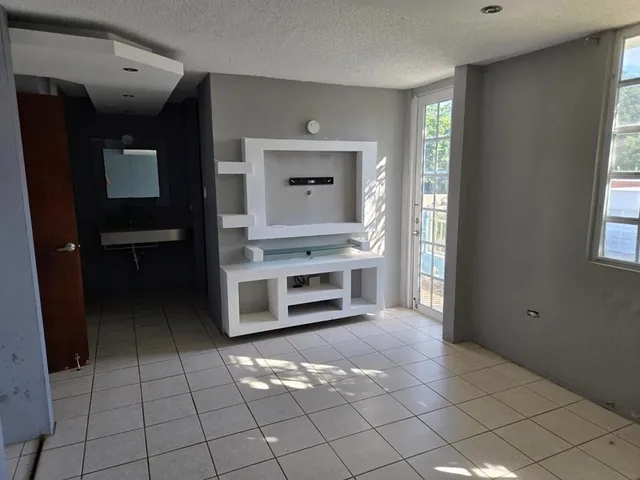 a view of an empty room with a window