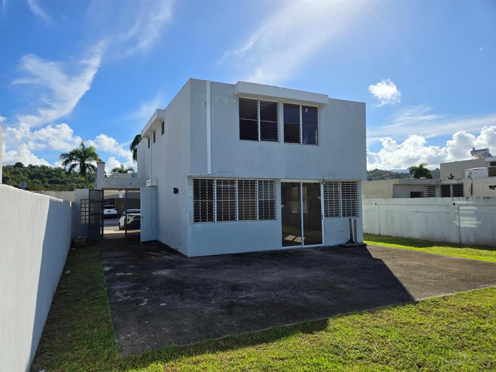 9 C. Rio La Plata, Unit 9E Bogalusa, LA 70427 - Photo 28 of 29 a view of a house with backyard and sitting area