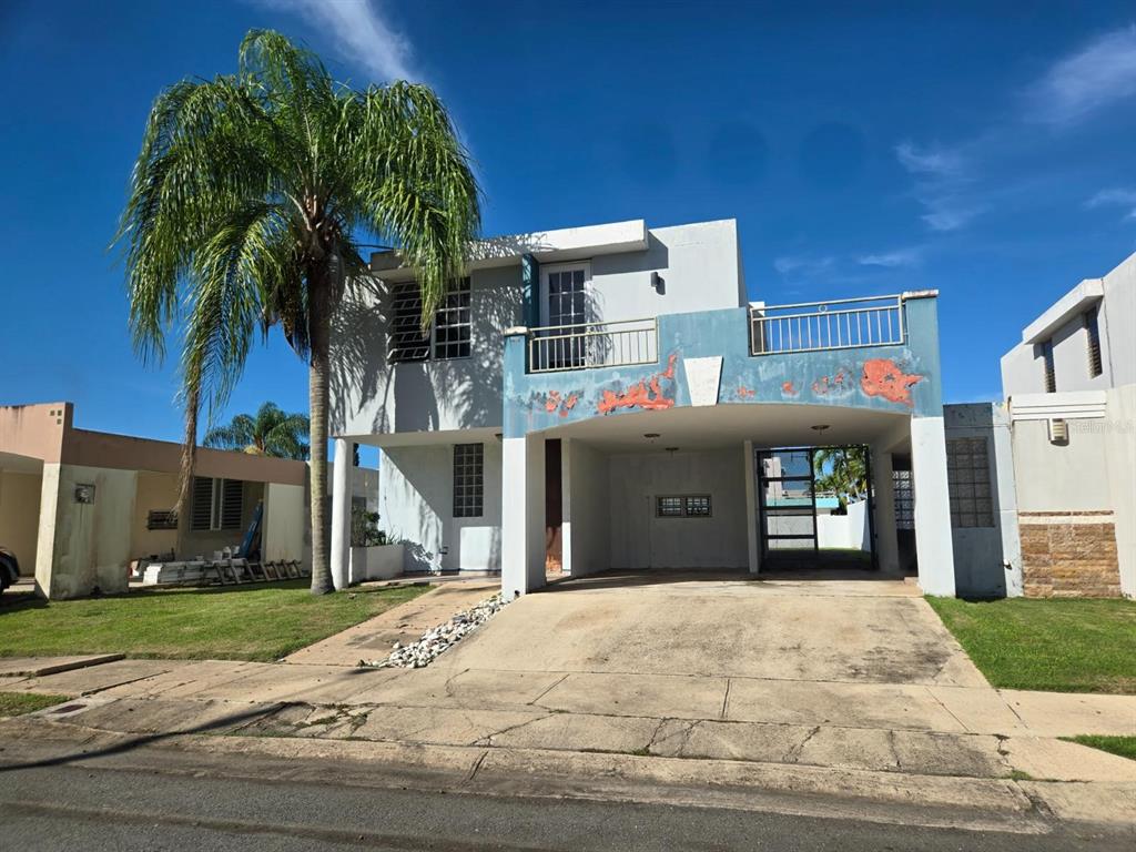 9 C. Rio La Plata, Unit 9E Bogalusa, LA 70427 - Photo 4 of 29 a front view of a house with a yard