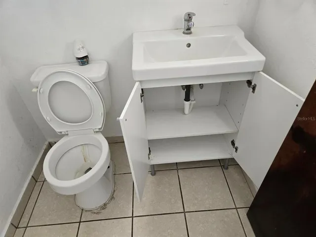 a bathroom with a toilet and a sink