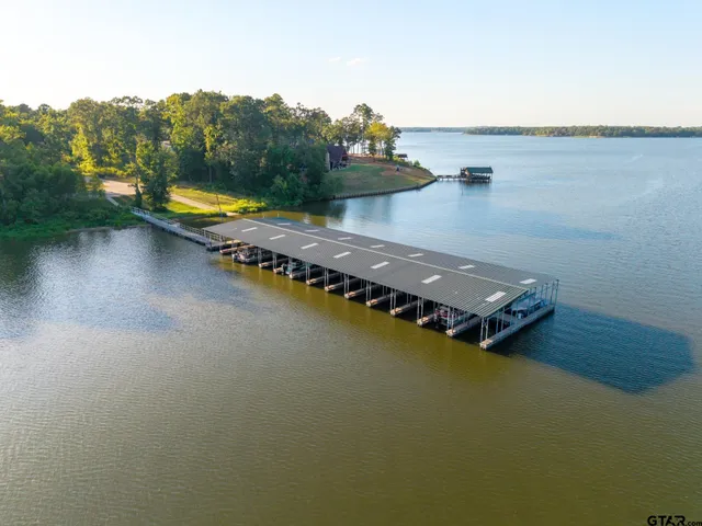 an aerial view of a house with ocean view