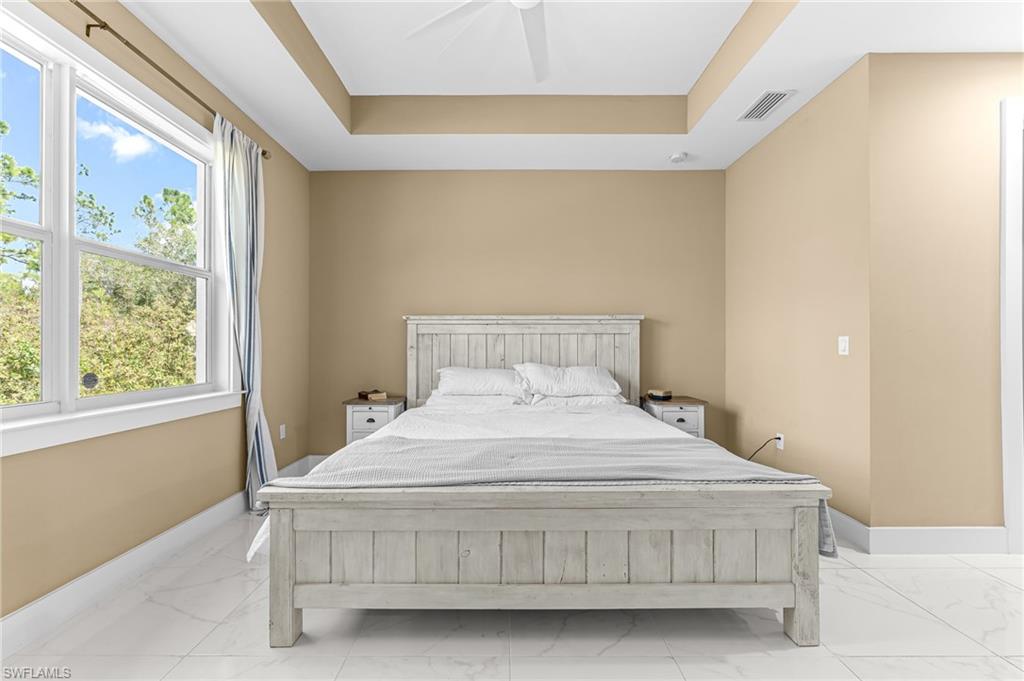 2793 72nd Avenue Northeast Naples, FL 34120 - Photo 23 of 50 a bedroom with a bed and window