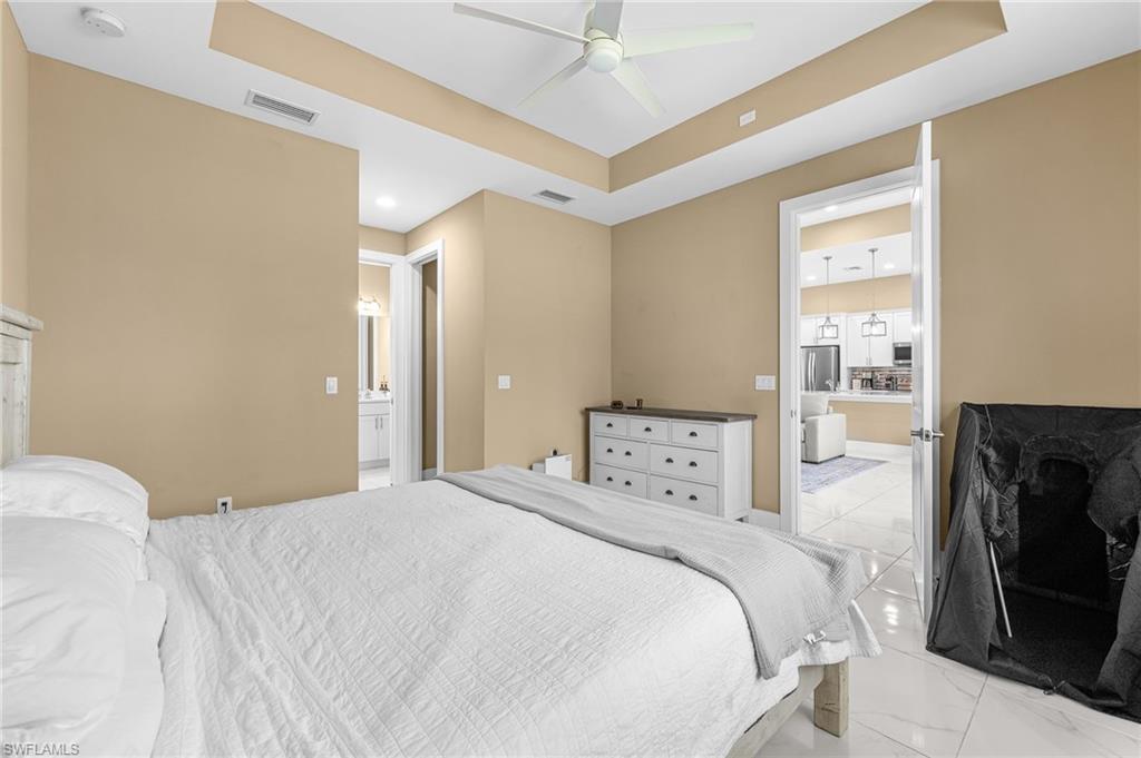 2793 72nd Avenue Northeast Naples, FL 34120 - Photo 26 of 50 a bedroom with a bed and a window
