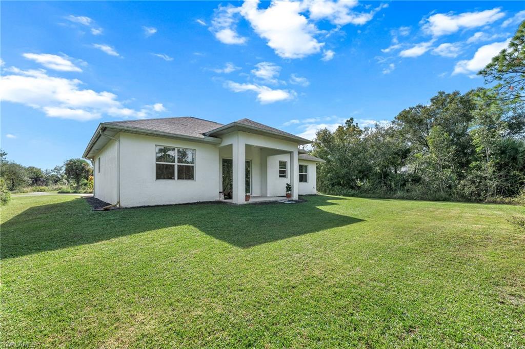 2793 72nd Avenue Northeast Naples, FL 34120 - Photo 37 of 50 a view of a house with backyard and garden