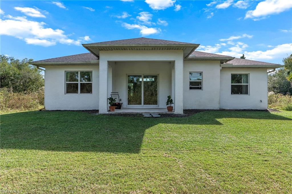 2793 72nd Avenue Northeast Naples, FL 34120 - Photo 38 of 50 a view of a house with a yard