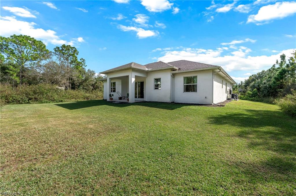 2793 72nd Avenue Northeast Naples, FL 34120 - Photo 39 of 50 a view of a house with yard and a garden