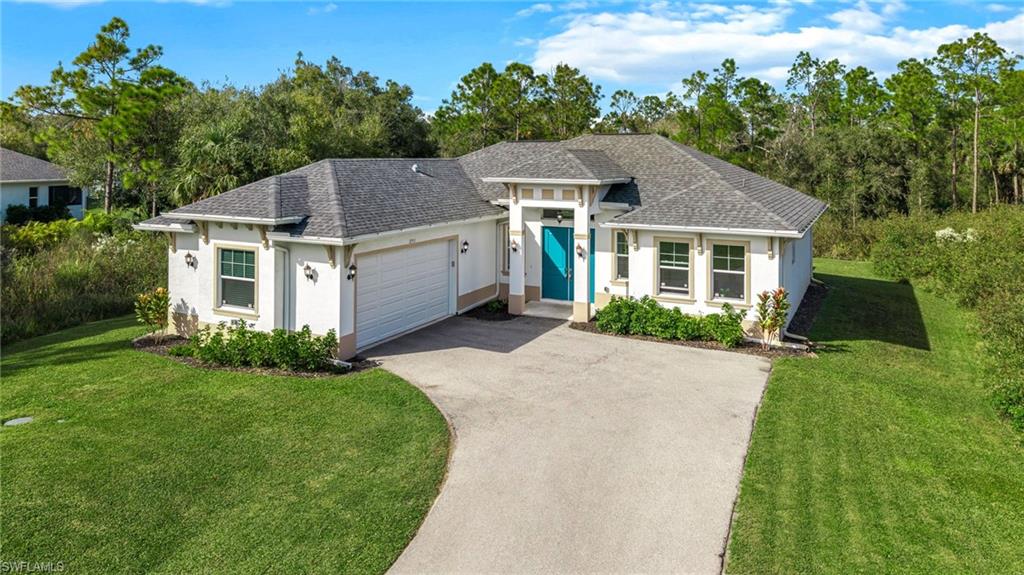 2793 72nd Avenue Northeast Naples, FL 34120 - Photo 40 of 50 front view of a house with a yard