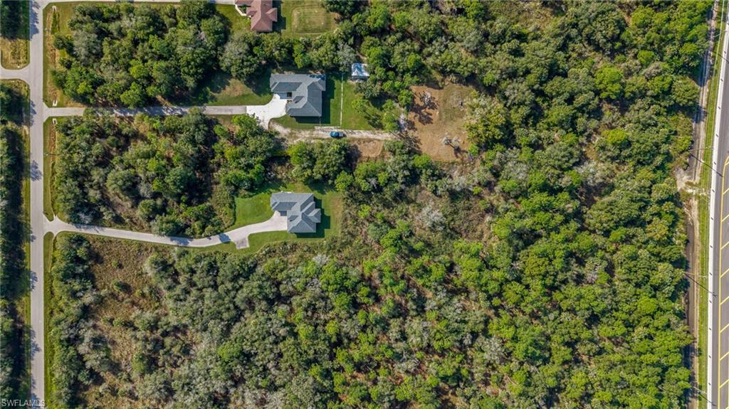 2793 72nd Avenue Northeast Naples, FL 34120 - Photo 48 of 50 a view of a wooden house with a yard and plants
