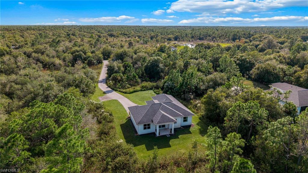 2793 72nd Avenue Northeast Naples, FL 34120 - Photo 50 of 50 an aerial view of a house with a yard