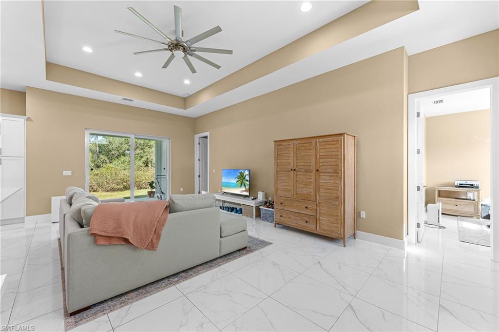 2793 72nd Avenue Northeast Naples, FL 34120 - Photo 8 of 50 a bed room with a bed and furniture