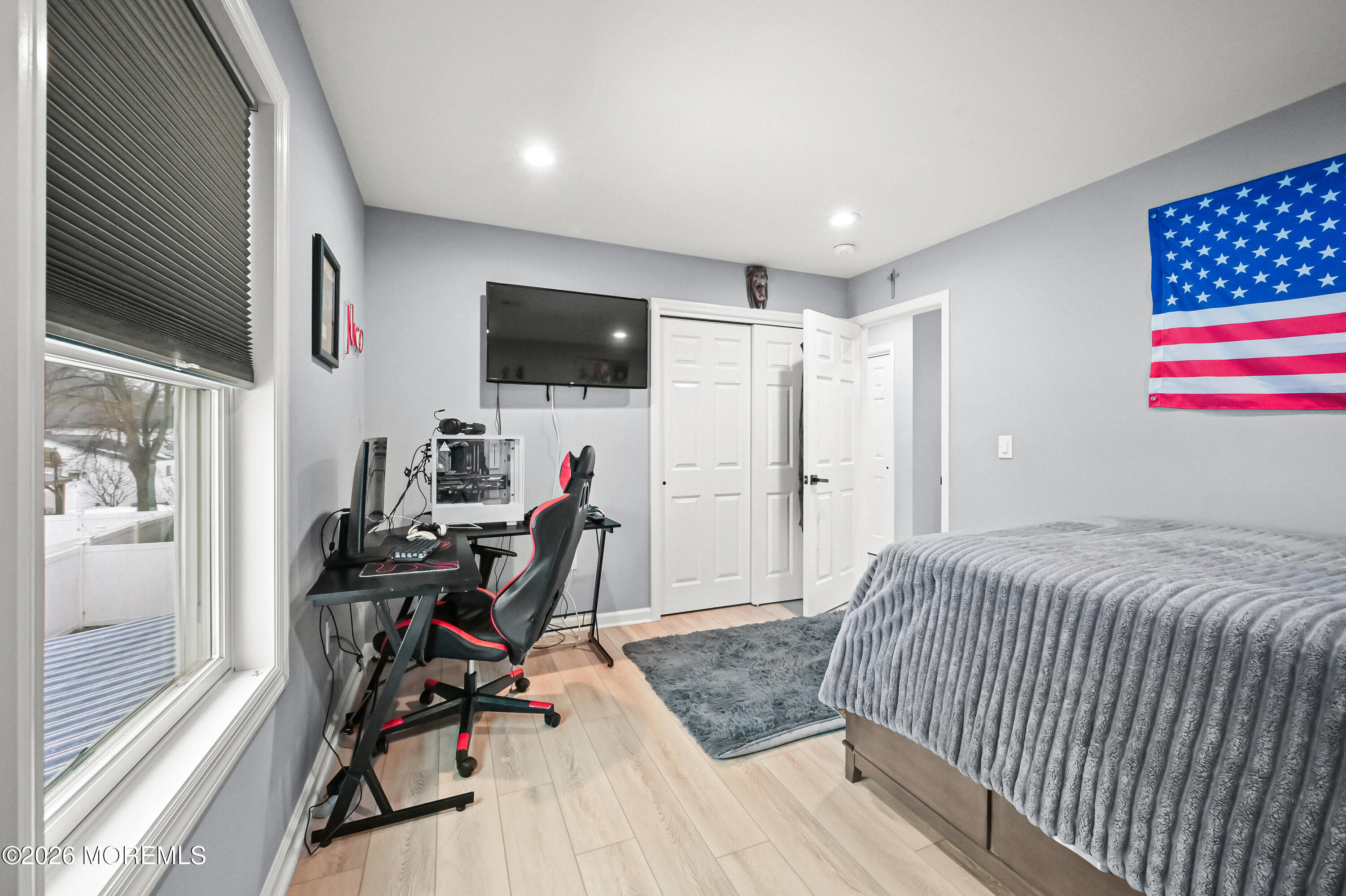 5 Limerick Place Hazlet, NJ 07730 - Photo 30 of 47 a bedroom with furniture a flat screen tv and a window