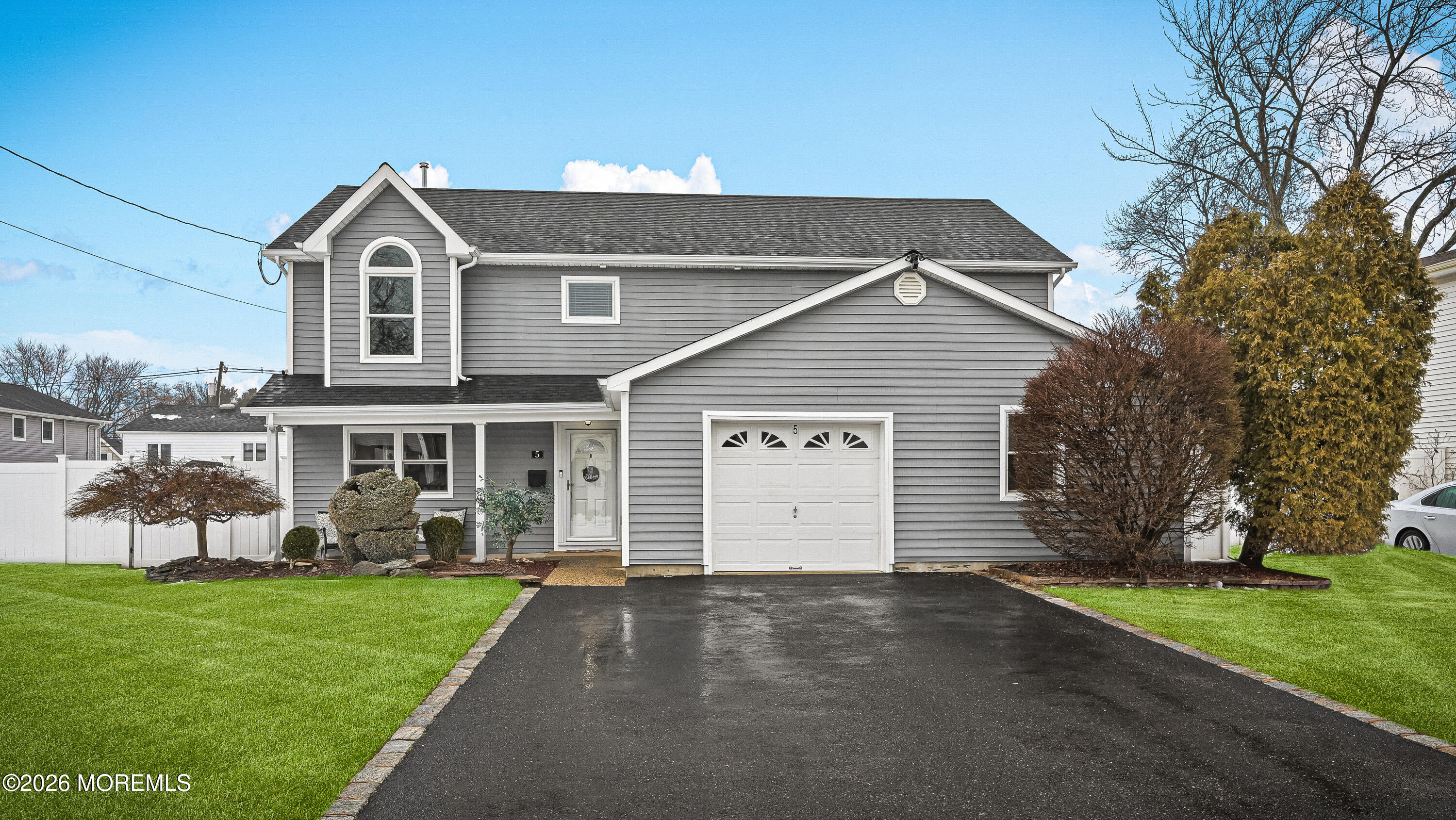 5 Limerick Place Hazlet, NJ 07730 - Photo 38 of 47 a front view of a house with a yard and garage