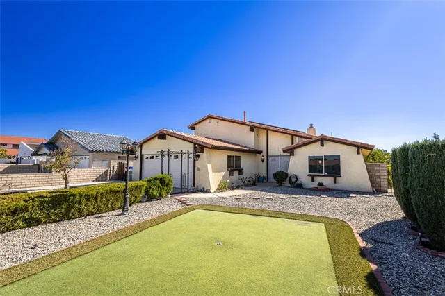 a front view of house with yard and seating area