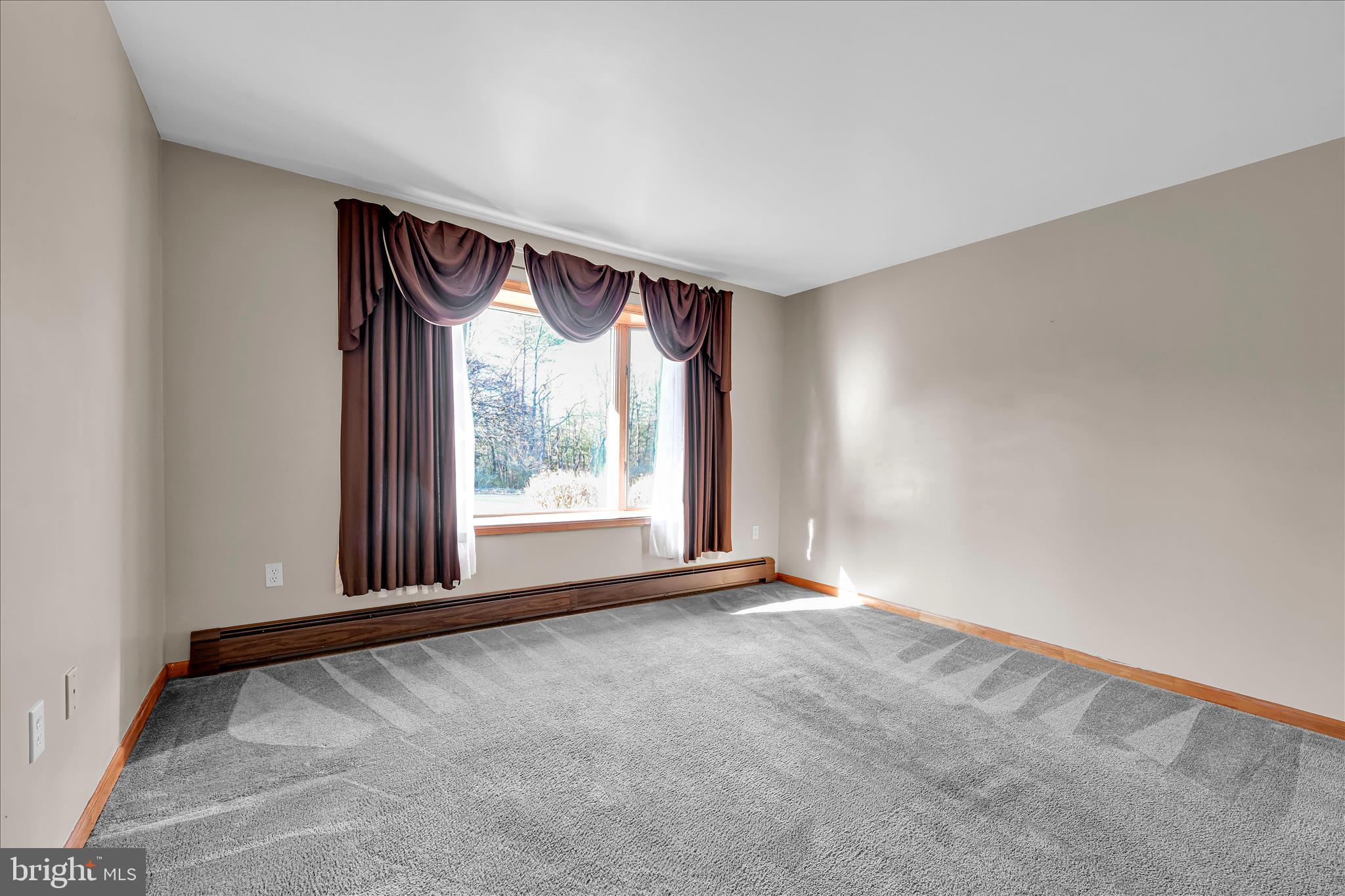 1039 Summer Hill Road Auburn, PA 17922 - Photo 12 of 40 a view of an empty room with a window