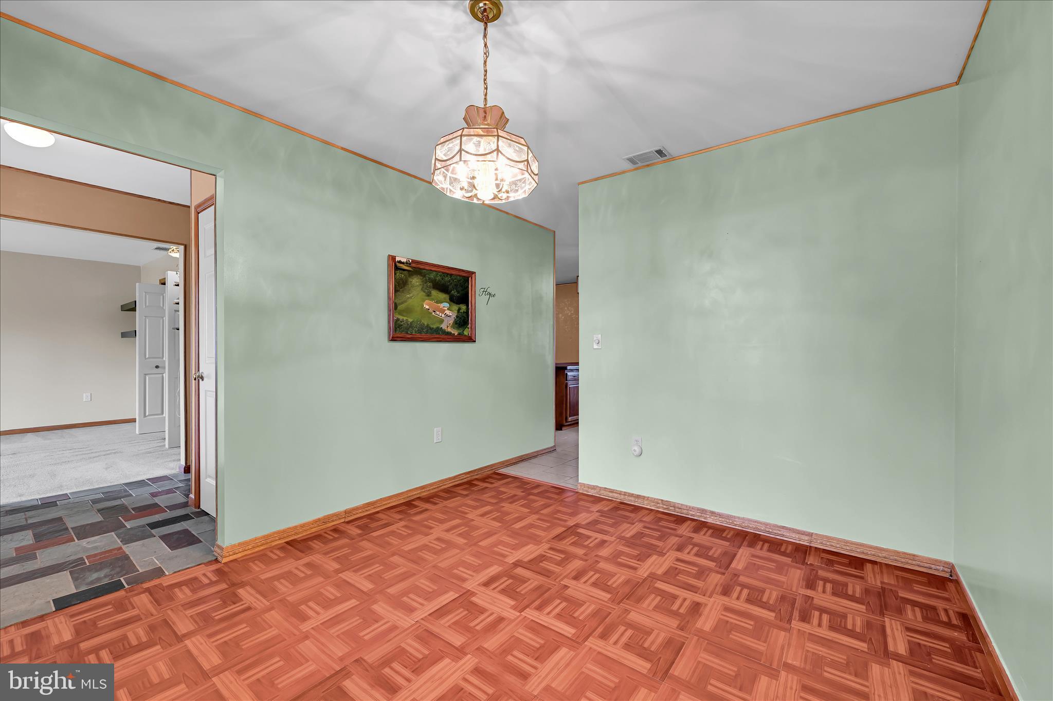 1039 Summer Hill Road Auburn, PA 17922 - Photo 16 of 40 a view of an empty room with a chandelier
