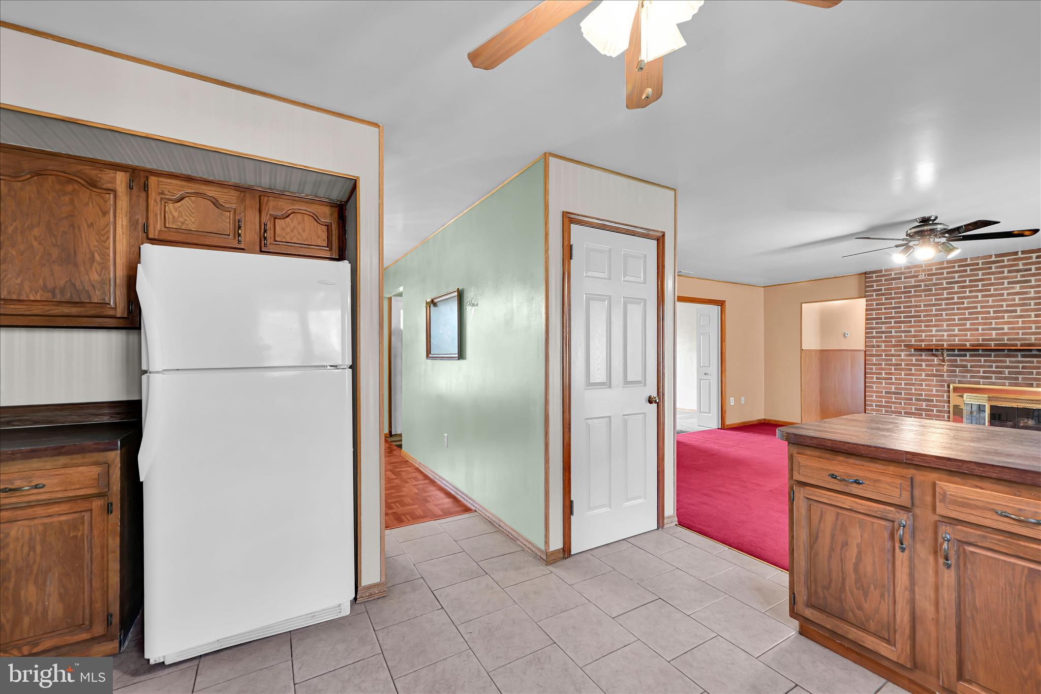 1039 Summer Hill Road Auburn, PA 17922 - Photo 20 of 40 a kitchen with granite countertop a refrigerator a sink and dishwasher