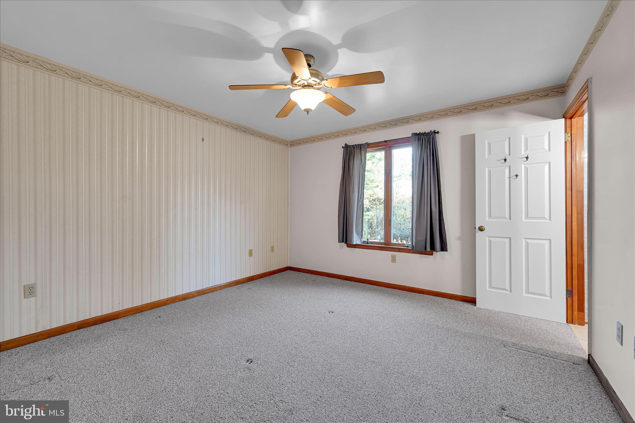 1039 Summer Hill Road Auburn, PA 17922 - Photo 23 of 40 a view of a livingroom with a ceiling fan and window