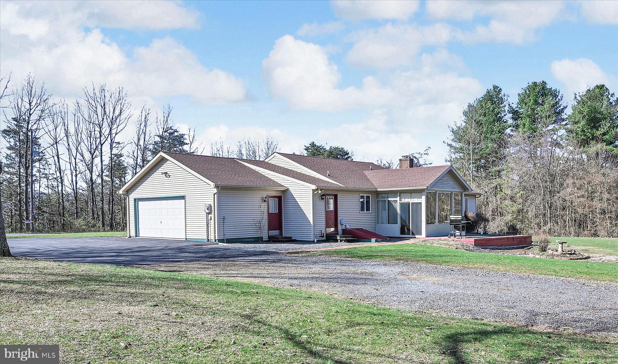 1039 Summer Hill Road Auburn, PA 17922 - Photo 37 of 40 a front view of a house with a garden and trees