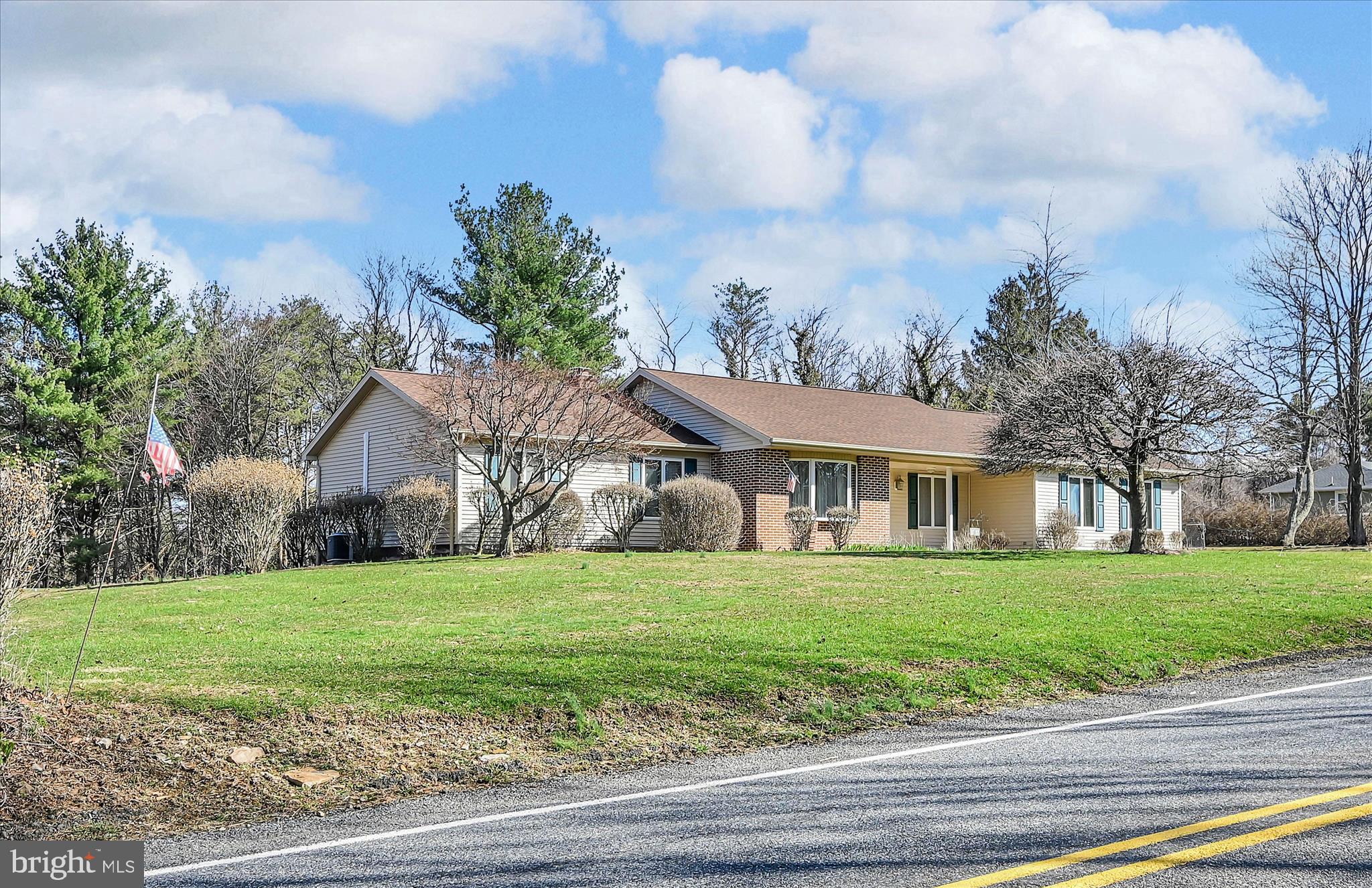 1039 Summer Hill Road Auburn, PA 17922 - Photo 7 of 40 a view of a house with a big yard and large trees