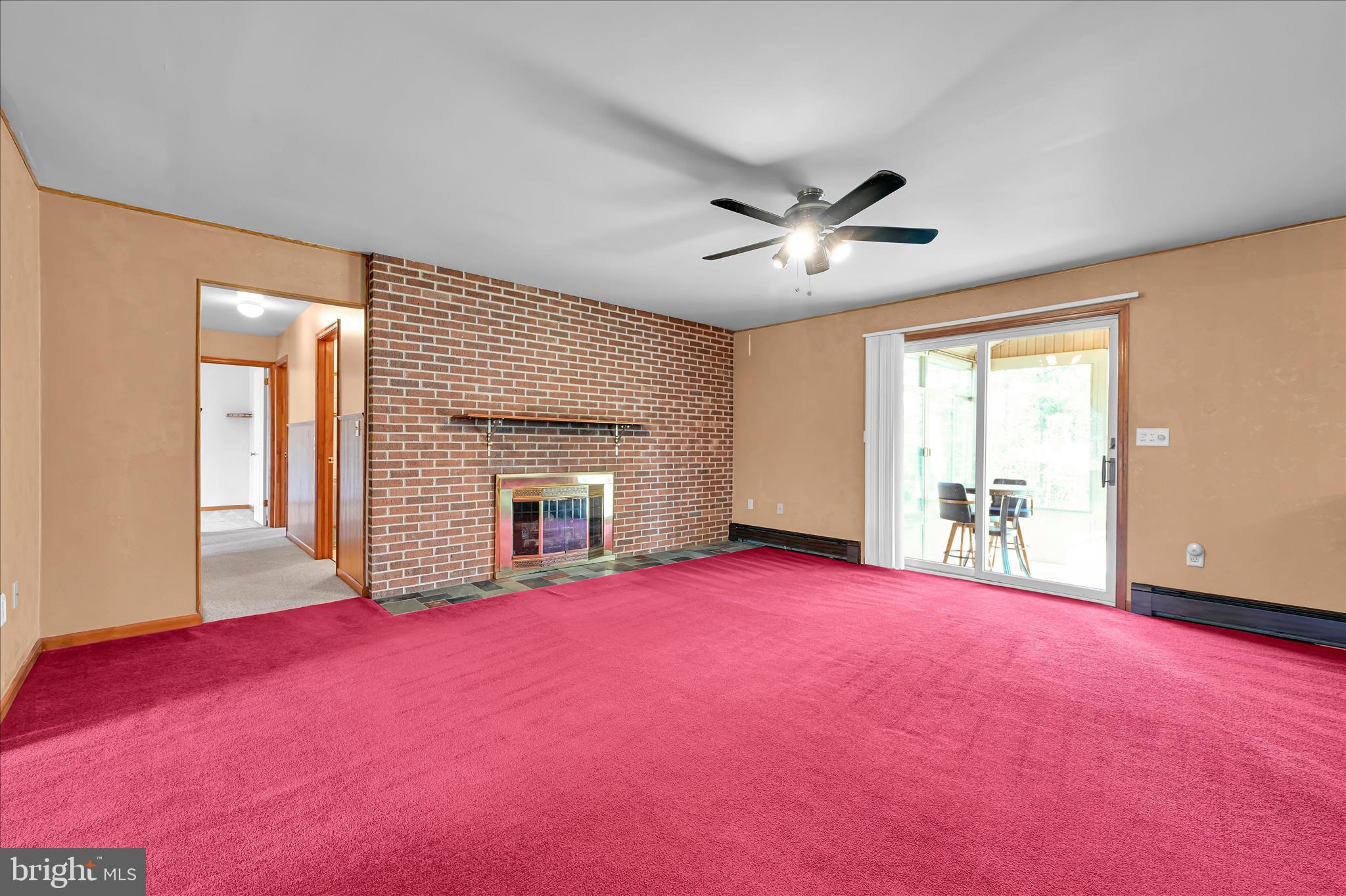 1039 Summer Hill Road Auburn, PA 17922 - Photo 10 of 40 a view of empty room with fireplace and large window