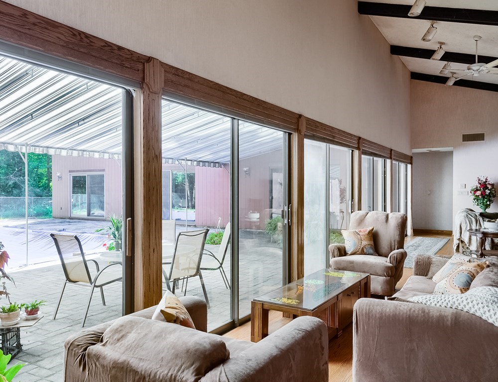 18 Old Lantern Circle Paxton, MA 01612 - Photo 14 of 41 a living room with furniture and floor to ceiling windows